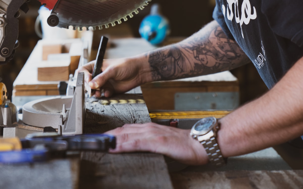 Handyman making a precise cut with a miter saw